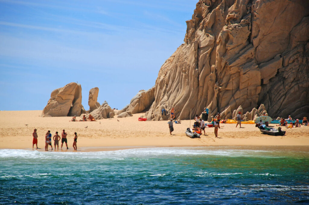 Tourists in Cabo arch beach