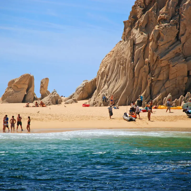 Tourists on Lover's Beach in Cabo San Lucas, Mexico.