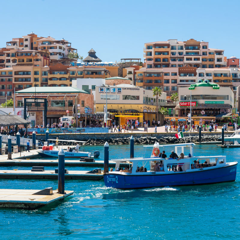 View of the Cabo San Lucas Marina Filled with Tourists and Boats in the Water