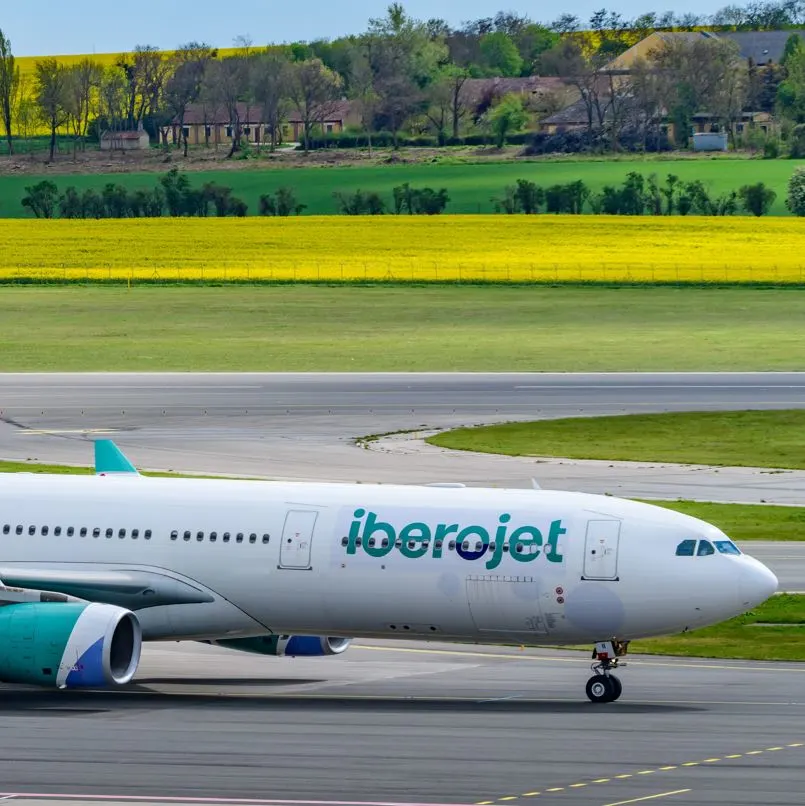 Iberojet plane on the tarmak near mountains