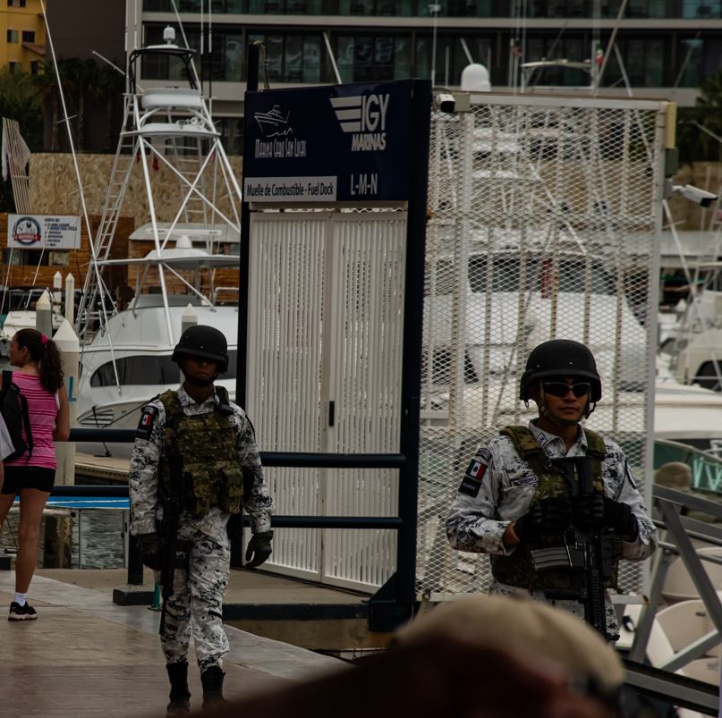 Authorities walking along the marina