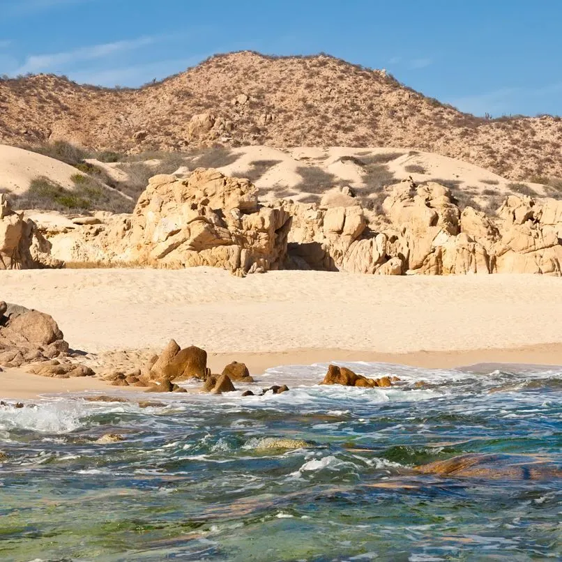 Mountains and desert behind a beach