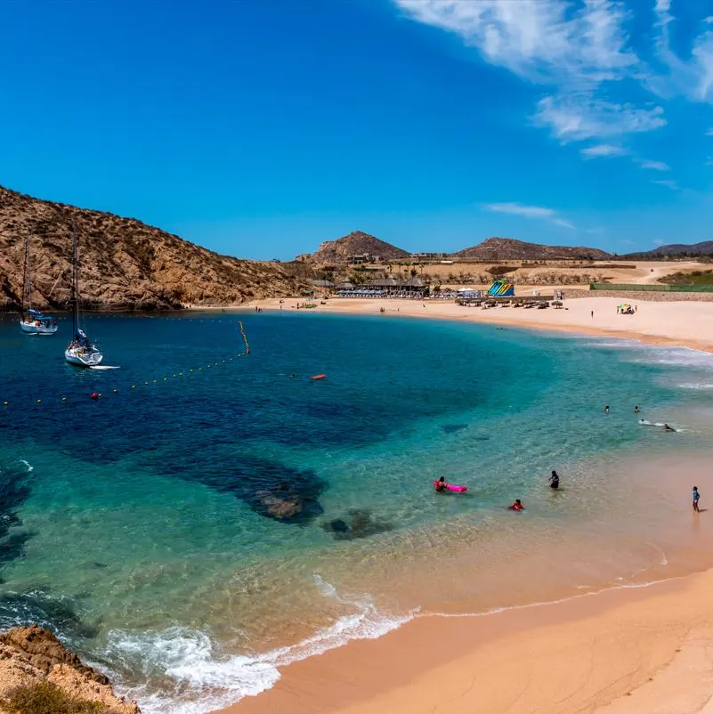 People swimming in the beach in Los Cabos, Mexico