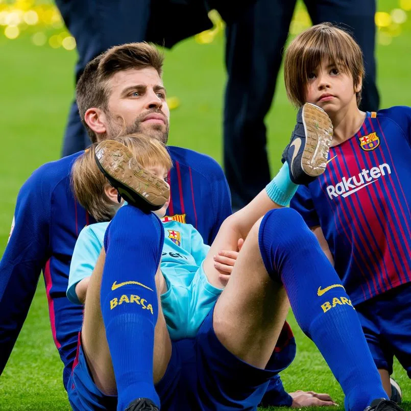 Gerard Pique and His Kids At A Barcelona Game