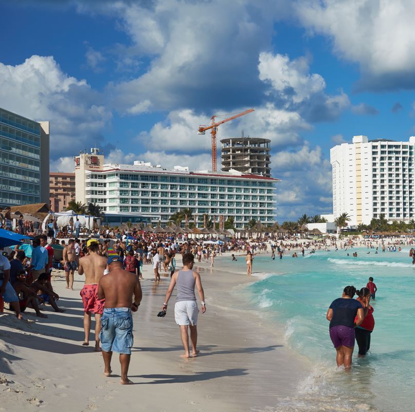 Packed Cancun Beach with some hotels still under construction