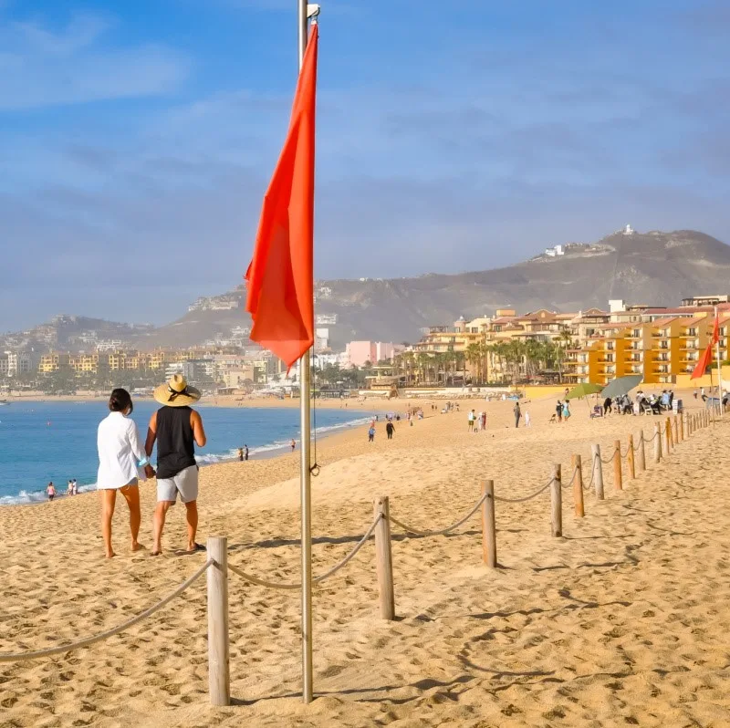 Red flag posted on closed beach in Mexico.
