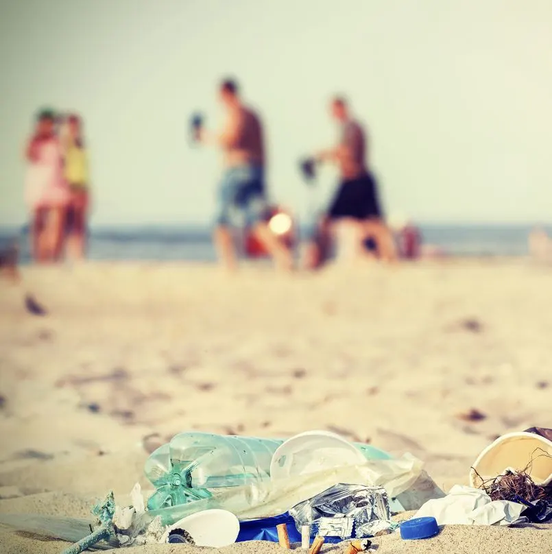 Trash on the beach with people
