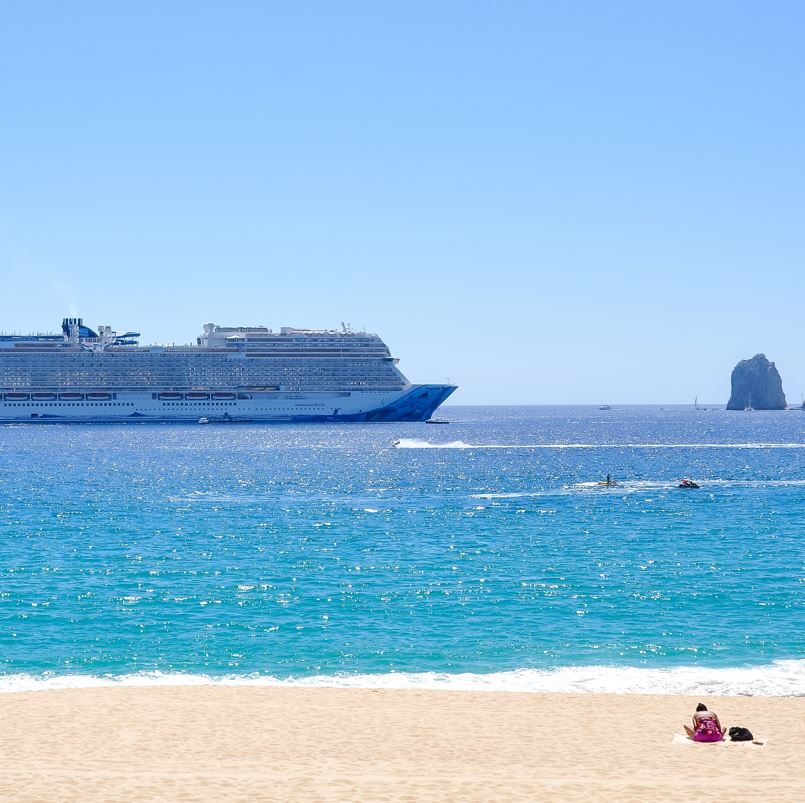 Large cruise ship passing the beach