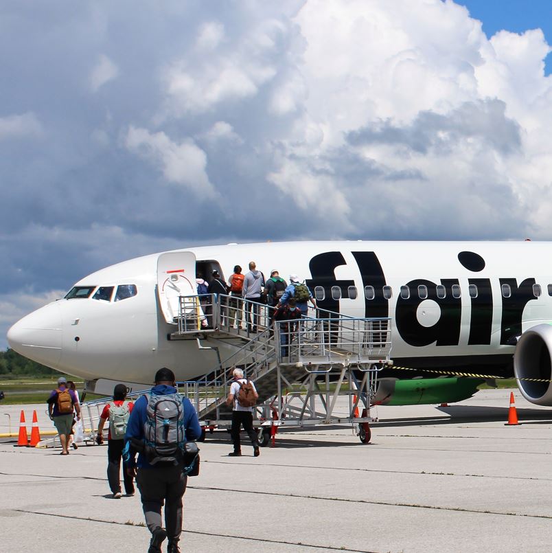 Passengers Boarding Flair Airlines Plane