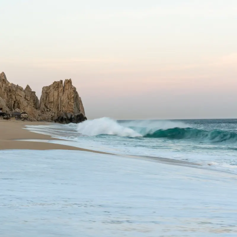 Waves reaching high up on the beach