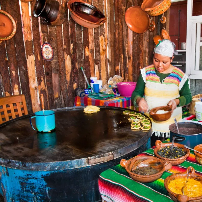 woman cooking food in los cabos