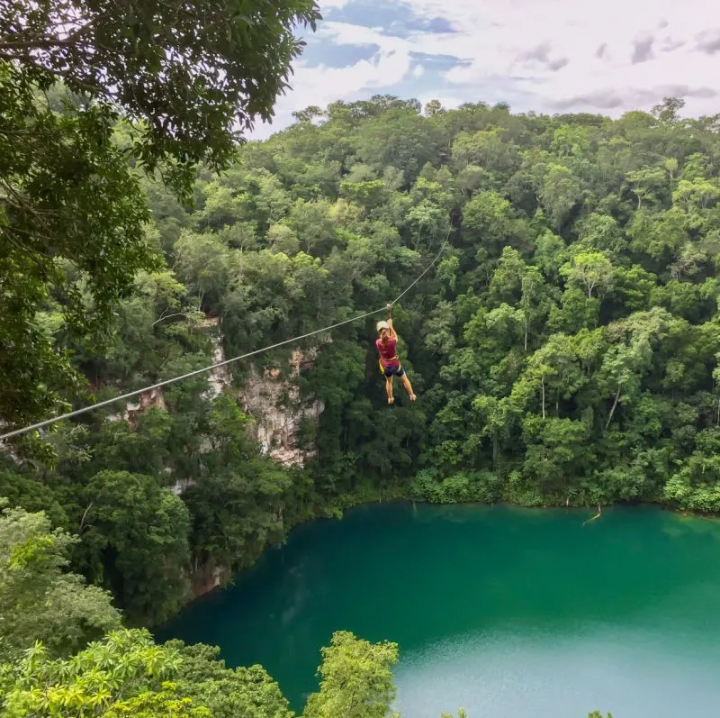Mexico Jungle Zipline someone ziplining across a body of water, los cabos