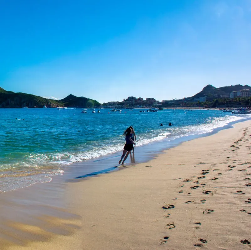 Tourists on Medano Beach in the sand