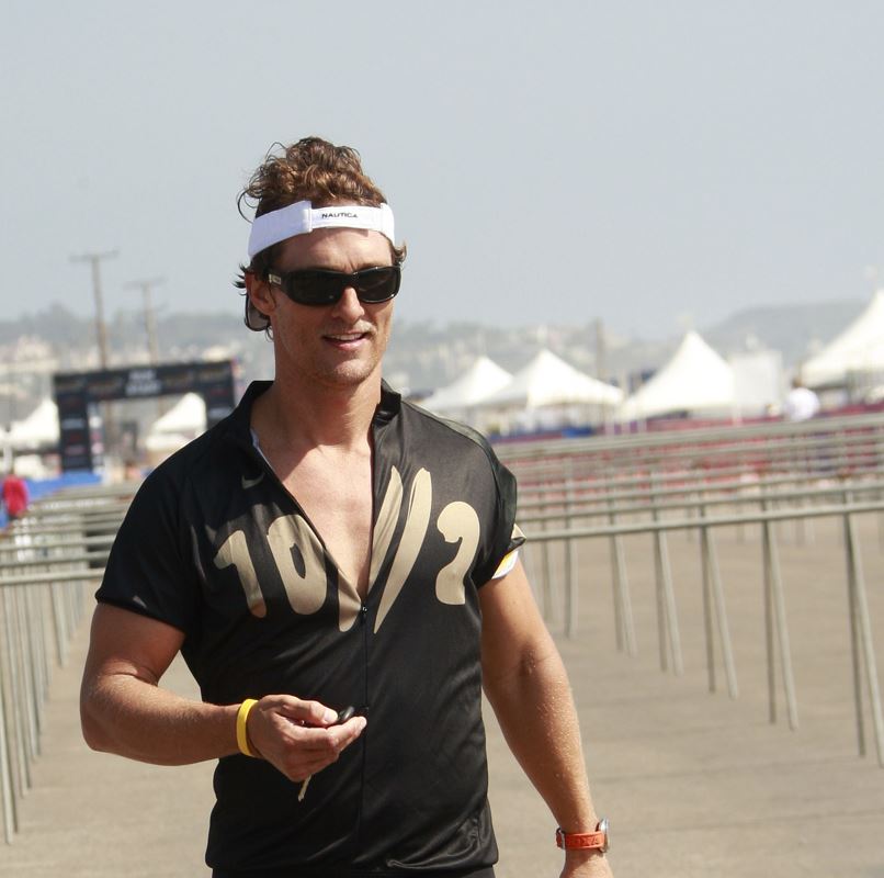 Matthew McConaughey running on a beach