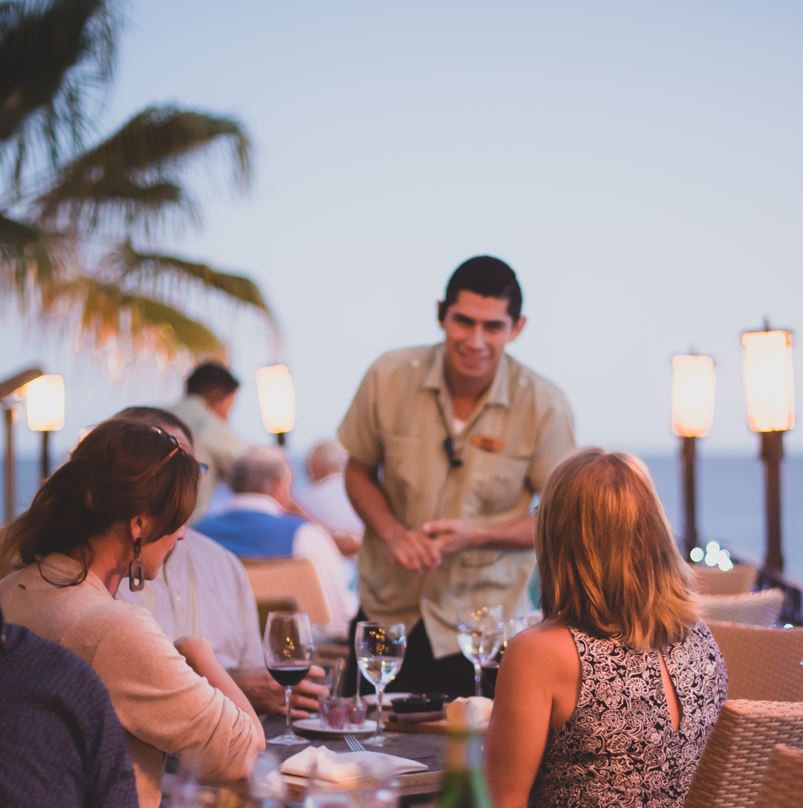 People eating at restaurant in cabo