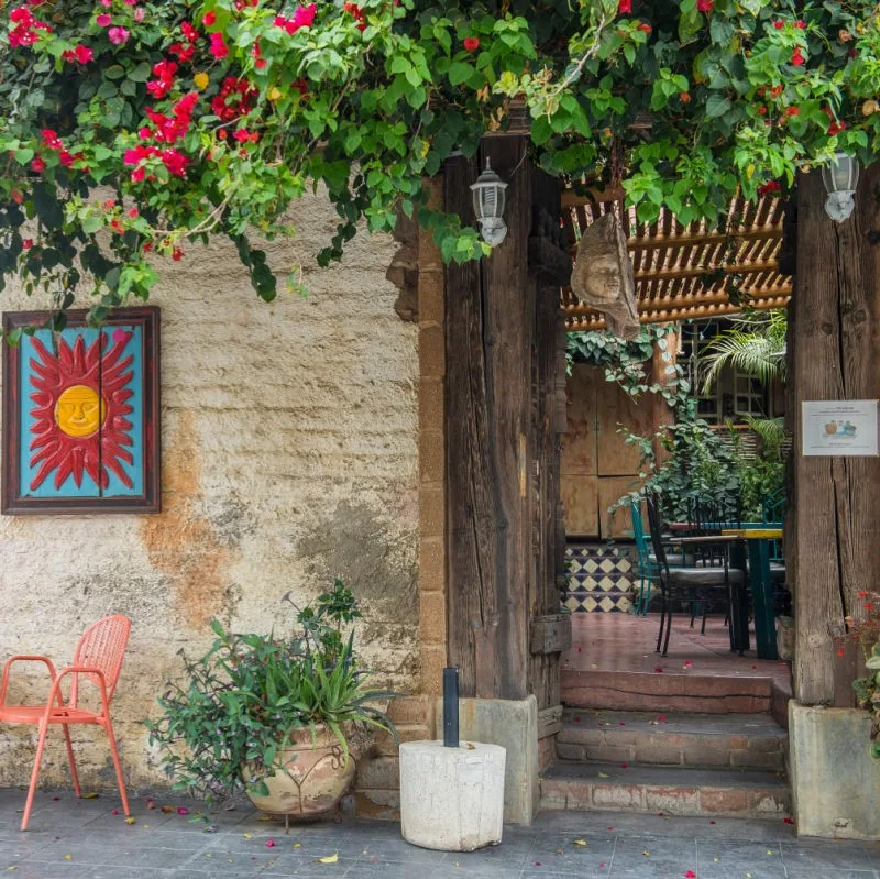 Todos Santos Street with view into a restaurant.