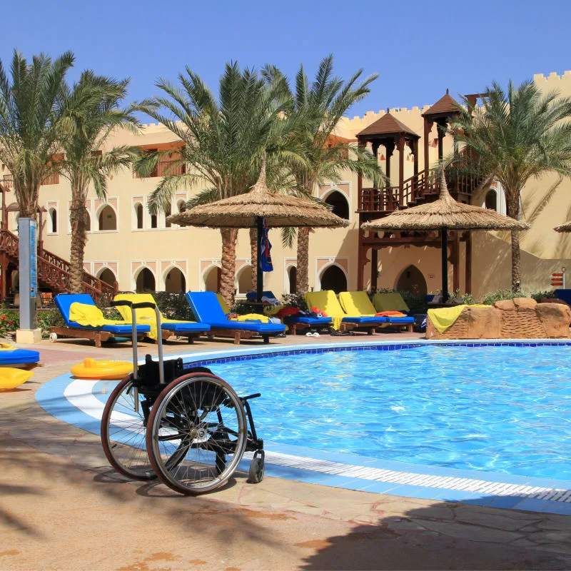 wheelchair by hotel pool