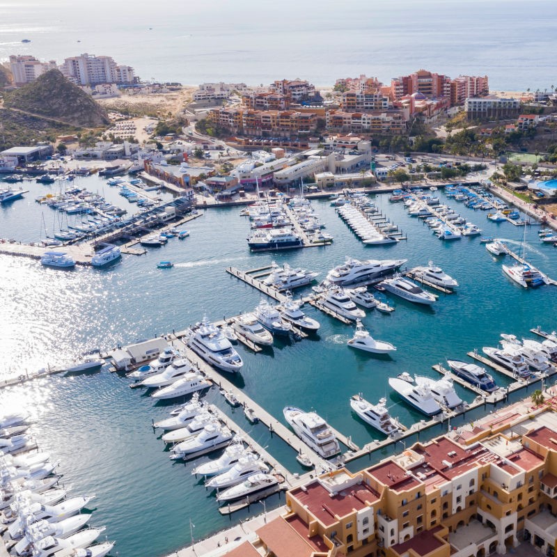 Aerial View of Cabo Marina and the sea with boats and buildings around the marina.