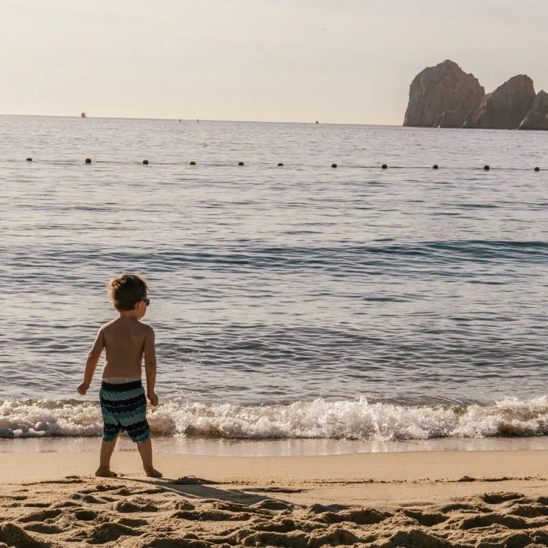 Child Playing on Beach