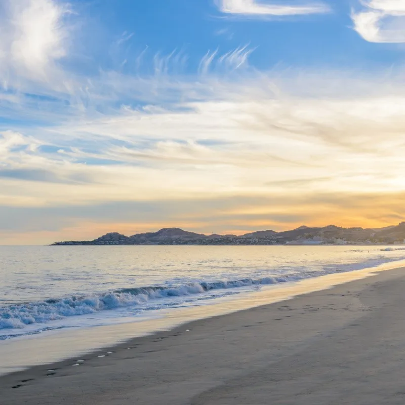 San Jose del Cabo Beach with clouds in the sky.