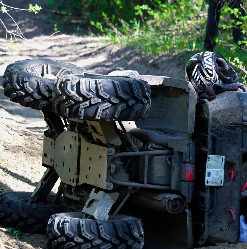 Crashed ATV on dirt road