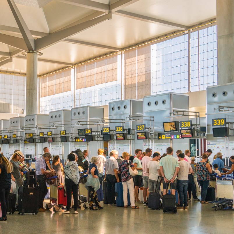 Check-in queue of airport with line of people