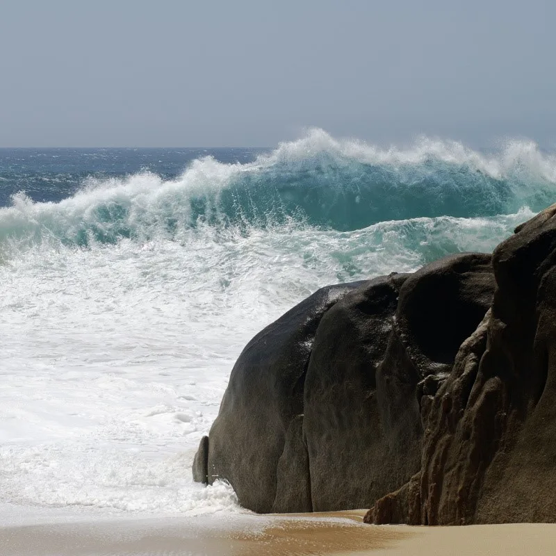 Big Wave in Cabo San Lucas at Lover's Beach on a Cloudy Day.