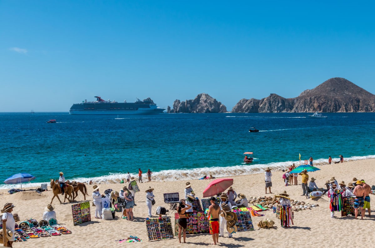 Busy Beach in Los Cabos with a View of Land's End