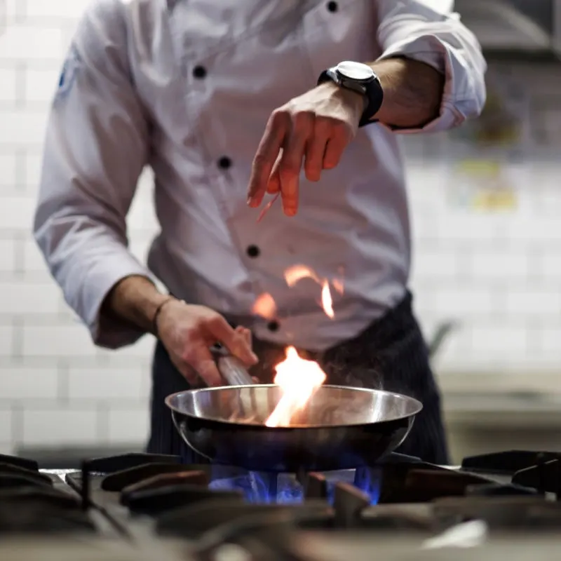 Chef preparing a meal during a cooking class