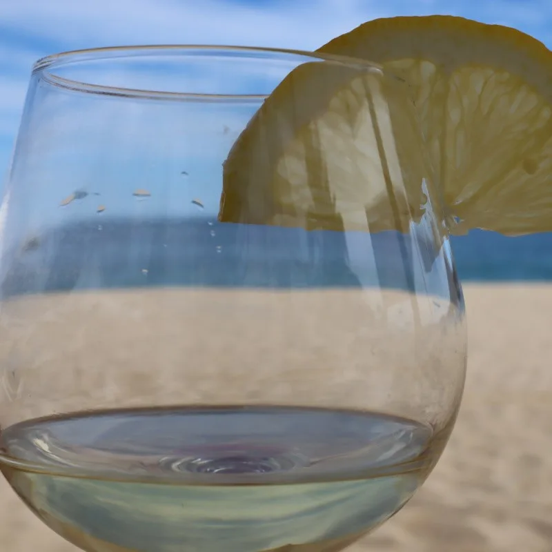 Closeup of Tequila Drink at Cabo Restaurant with View of the Beach in the Background