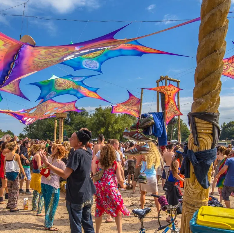 People At A Music Festival Being Held In A Sandy Beach