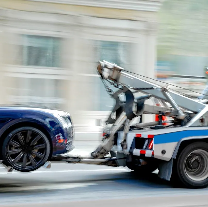 Police truck towing a vehicle