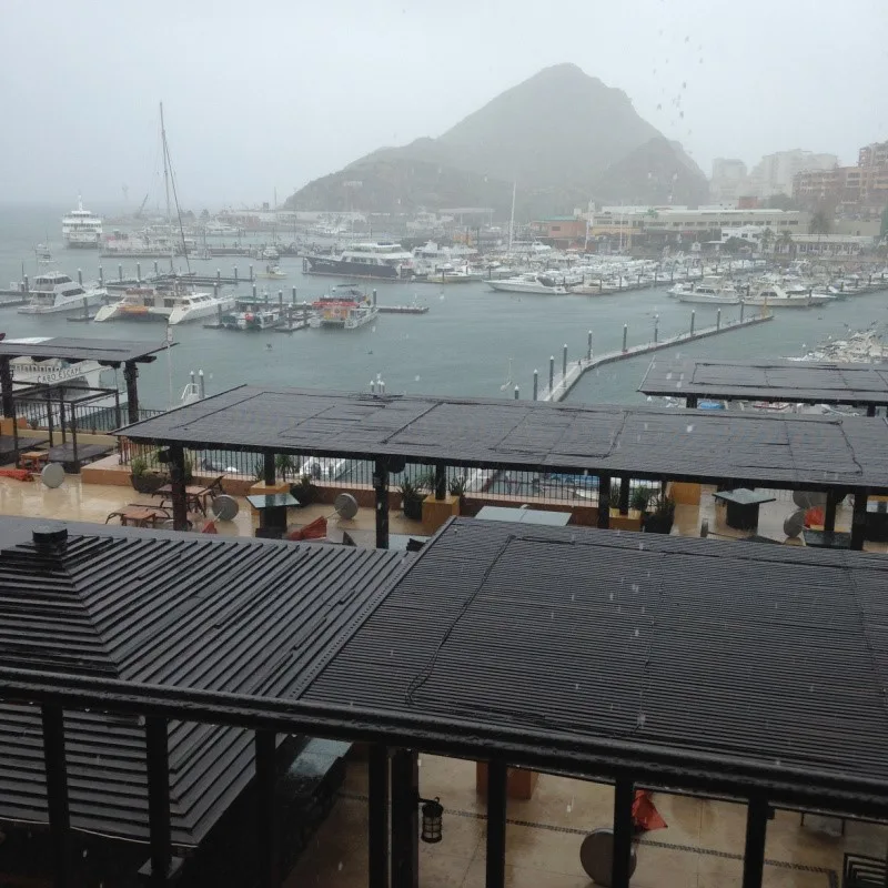 Stormy Day in Cabo overlooking the marina with a view of boats while it's raining.