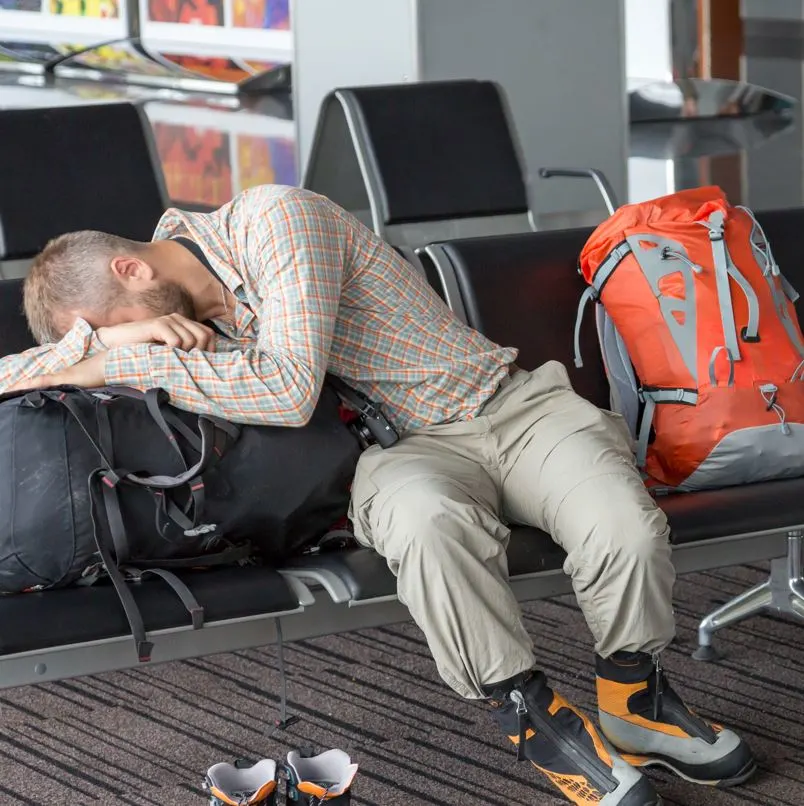 Tired Tourist At Airport