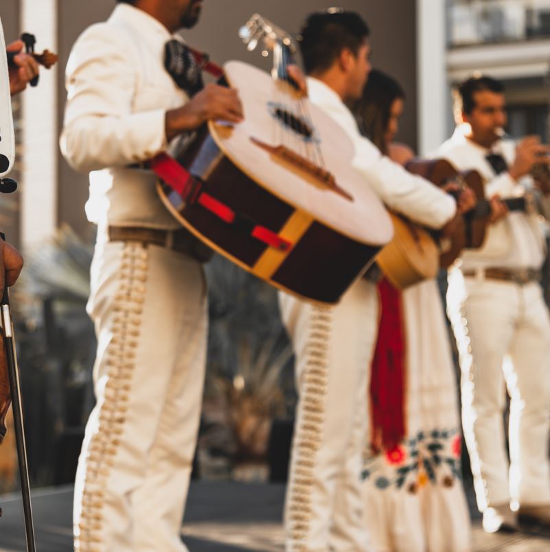 Members of a band playing their instruments