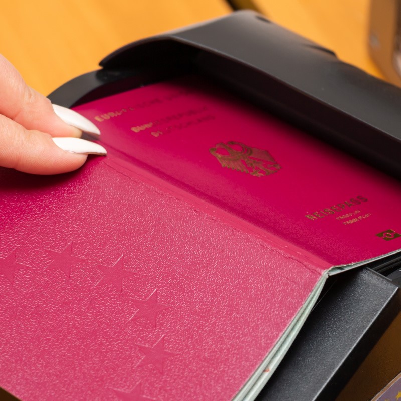 Passport Being Checked in a Passport Scanner