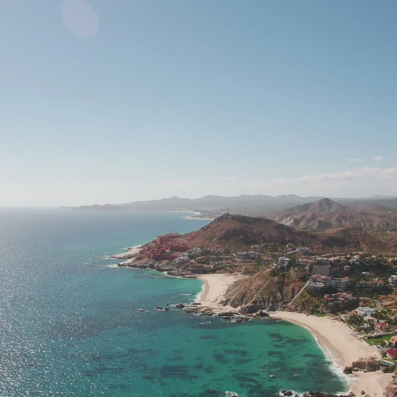 San Jose Del Cabo Coastline surrounded by hills.