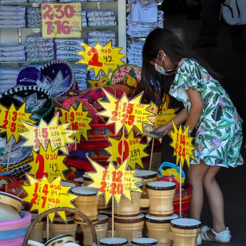 Little Girl Buying Souvenirs at a Shop in the Cabo San Lucas Marina