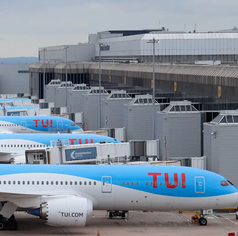 Tui airplanes parked at an airport