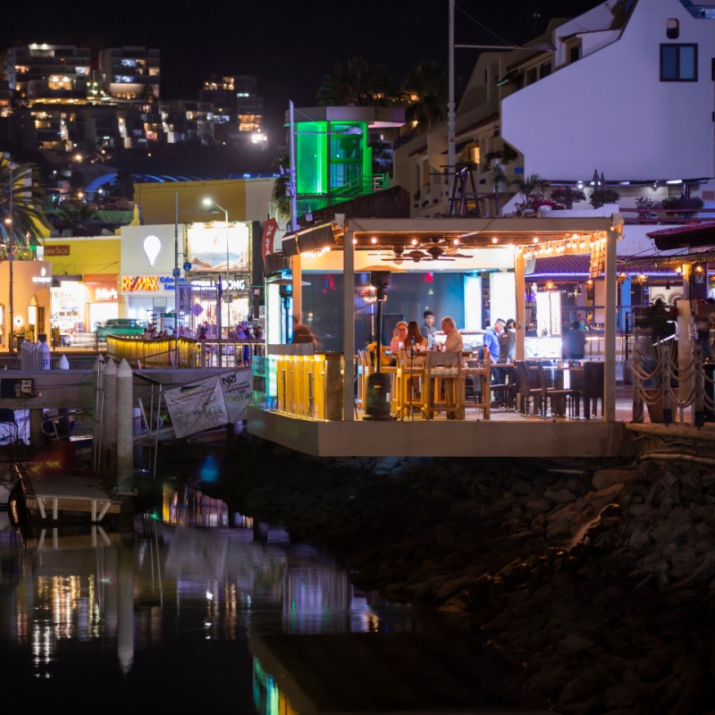 Tourists Dining Outdoors at Night in Cabo San Lucas Marina Area