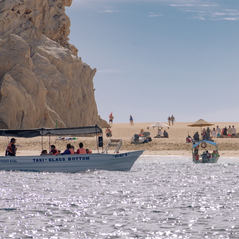 Tourists Enjoying a Beach in Los Cabos