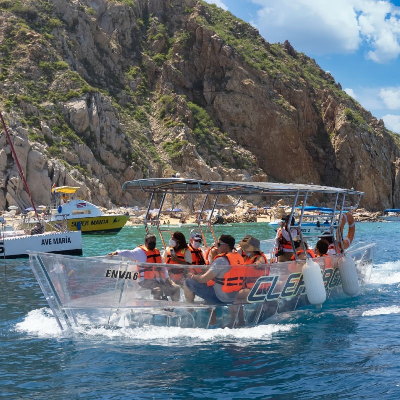 Tourists Taking a Clear Bottom Boat Tour in Los Cabos