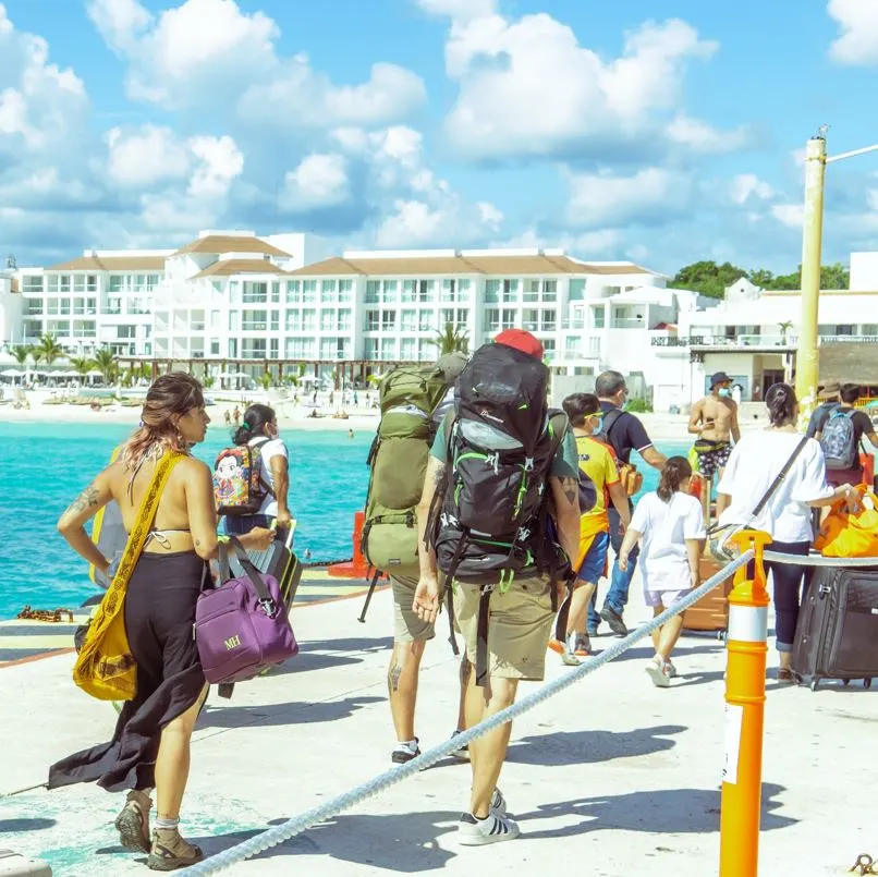 Tourists arriving at a dock after getting off a boat