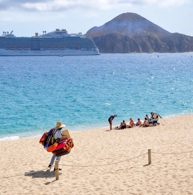 Travelers enjoying el medano beach in los cabos