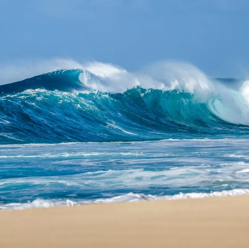 Waves breaking on the shore