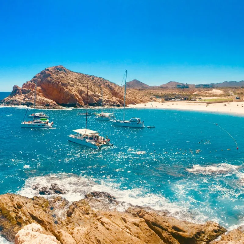 Boats and Beachgoers at Santa Maria Beach in Los Cabos, Mexico