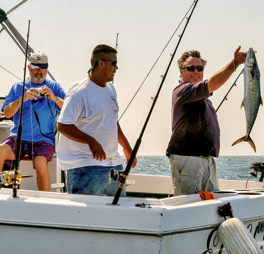 Three men fishing on a boat