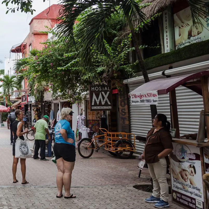 Tourists Trying To Get A Massage On A Mexican Beach Town