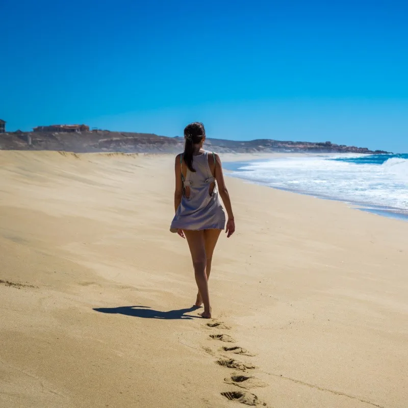 Woman Taking a Walk on a Beach in Los Cabos
