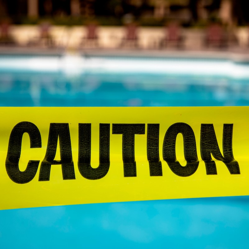 Caution Tape at a Resort Pool